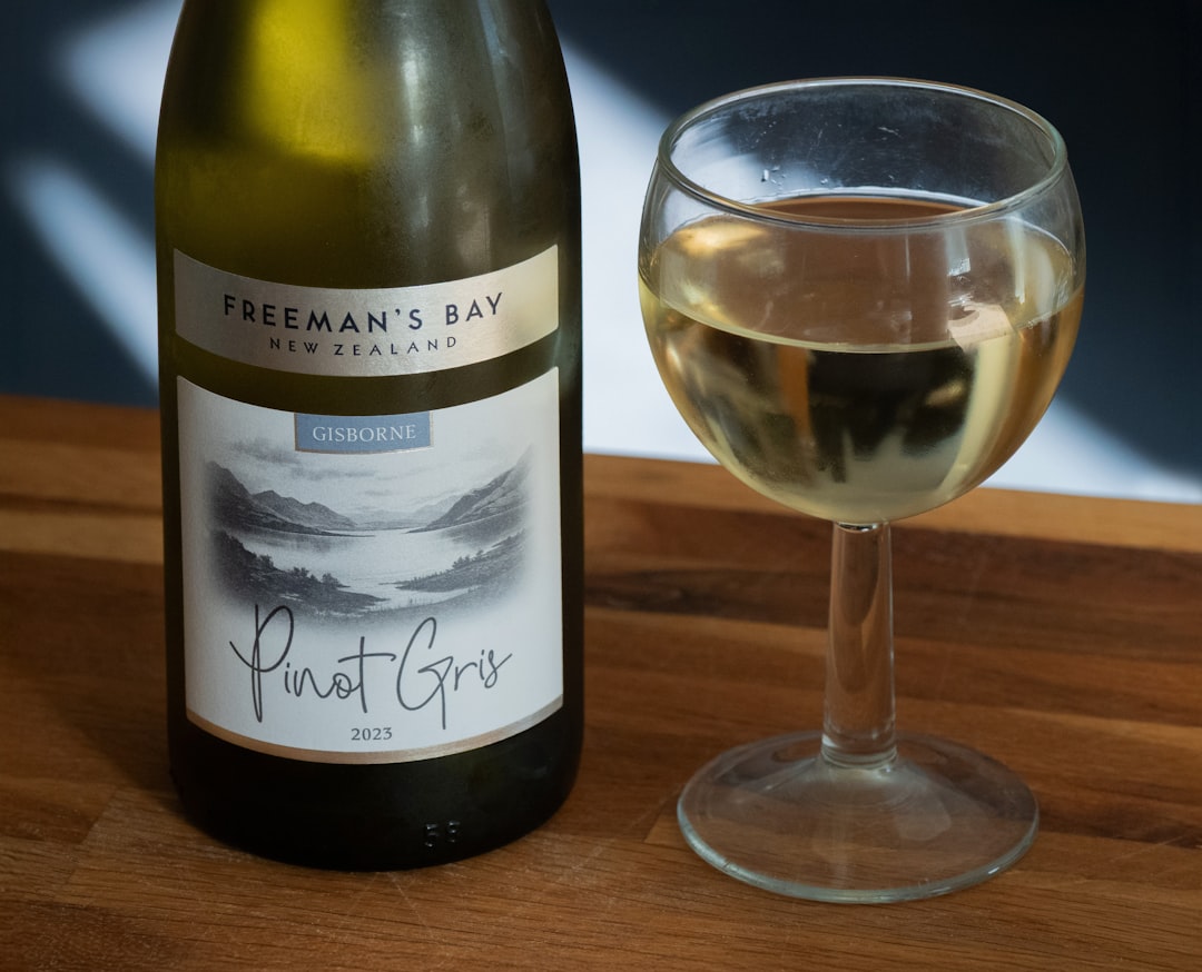 Bottle of pinot gris with a glass of white wine
