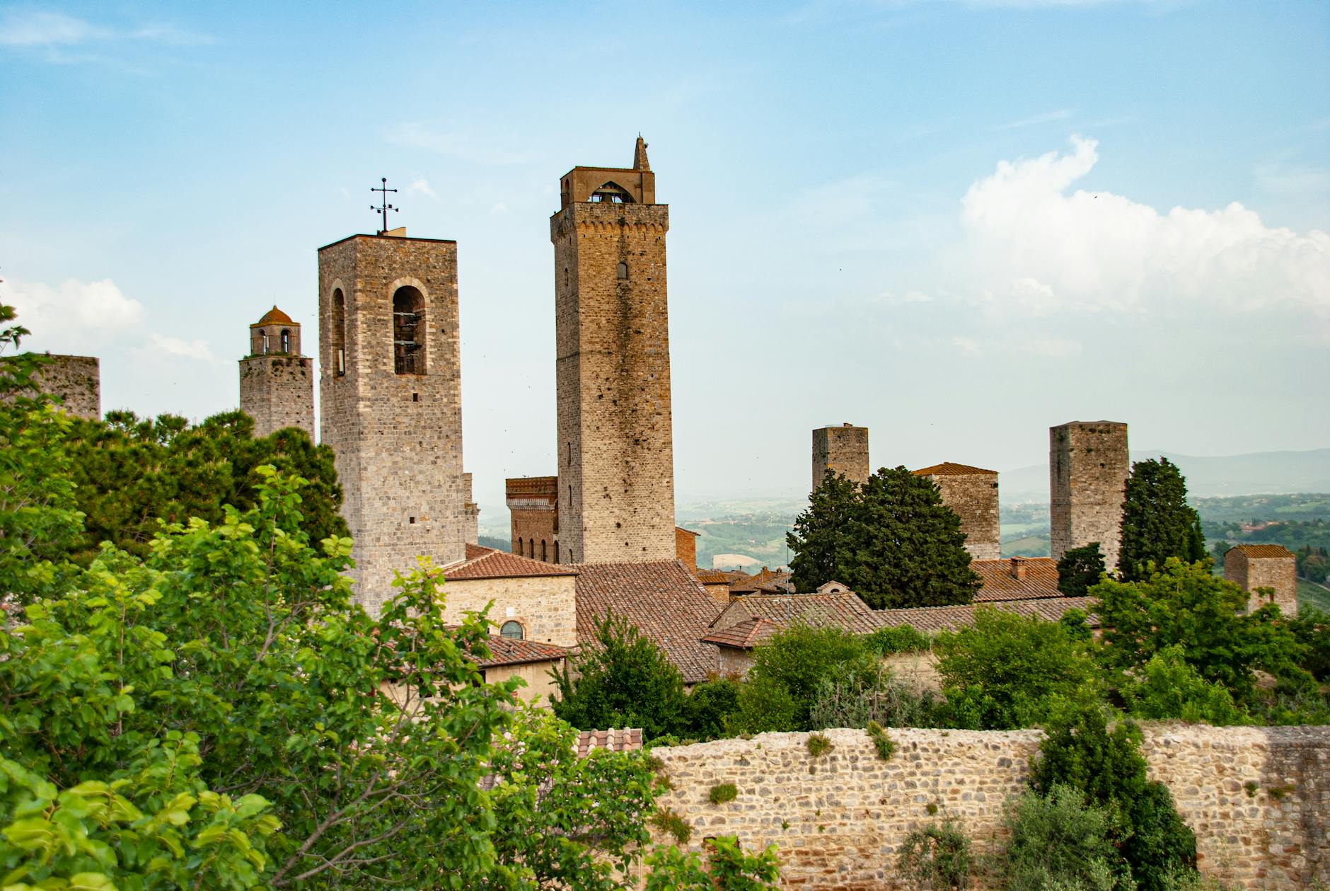 Stunning view of medieval towers in San Gimignano, Tuscany, showcasing historic architecture and scenic landscapes.